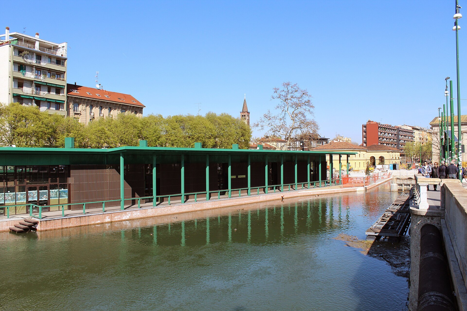 The covered market building alongside the Darsena