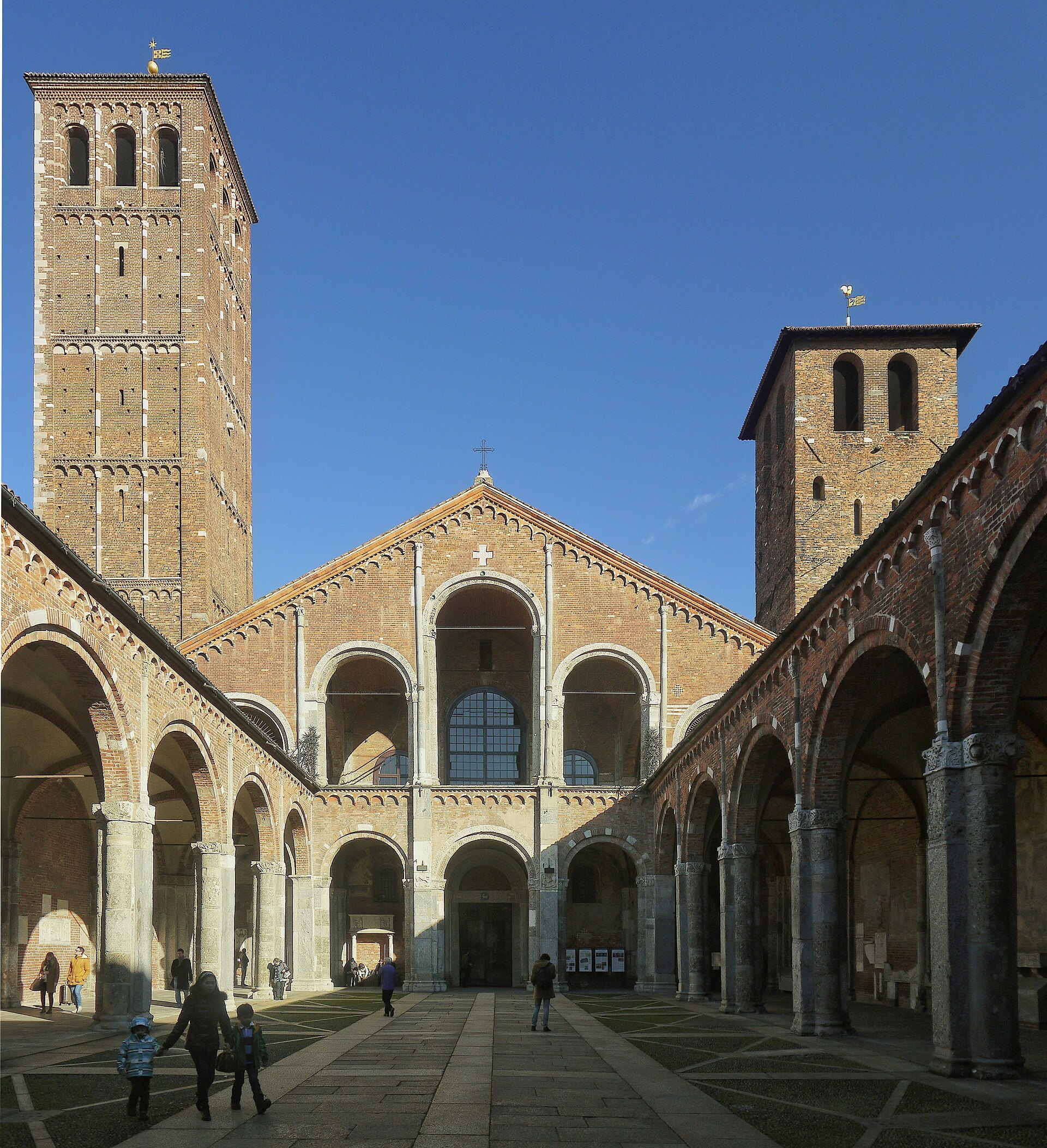 The atrium of Sant'Ambrogio looking through to the brick front and its two unequal towers