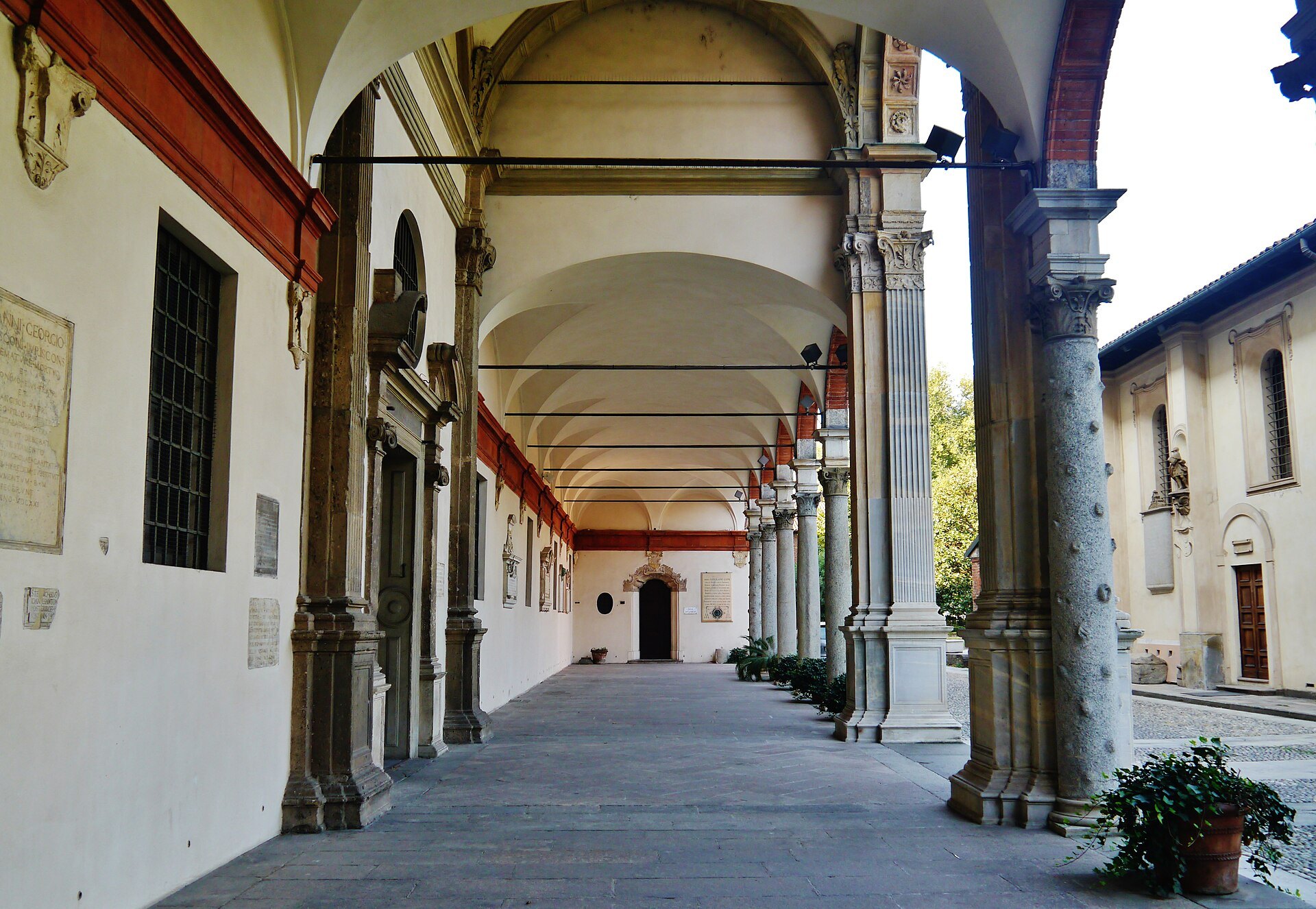 The colonnaded atrium of Sant'Ambrogio, brick arches on stone columns