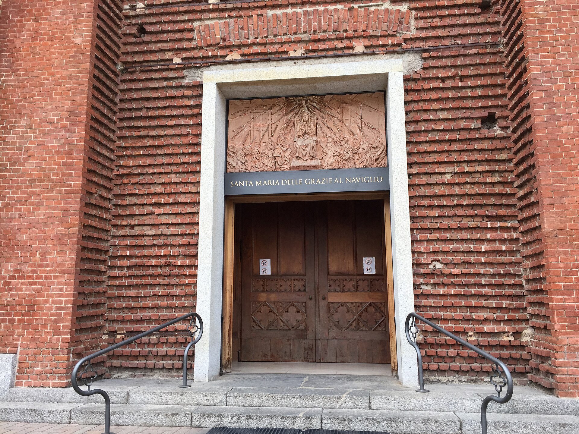The doorway of Santa Maria delle Grazie, closed, in its brick wall