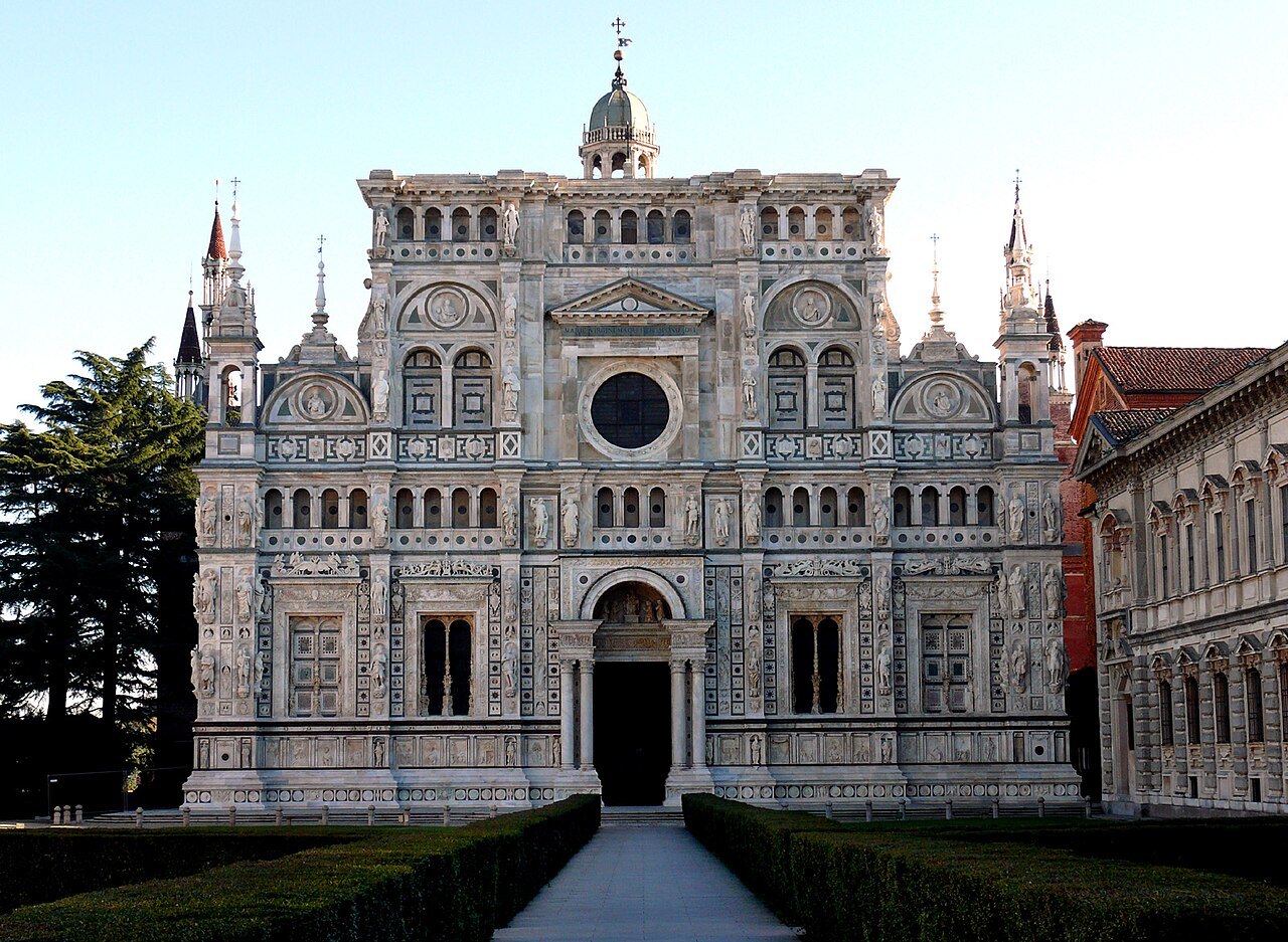 The carved marble front of the Certosa di Pavia at the end of its avenue
